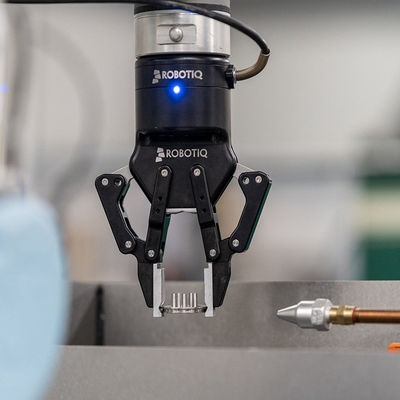 Los recambios del agarrador de ROBOTIQ de la mano-e del brazo robótico del robot combinan con el robot colaborativo de UR
